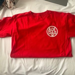 Red Adidas shirt. Great condition. Worn once. Size small but fits a medium.
